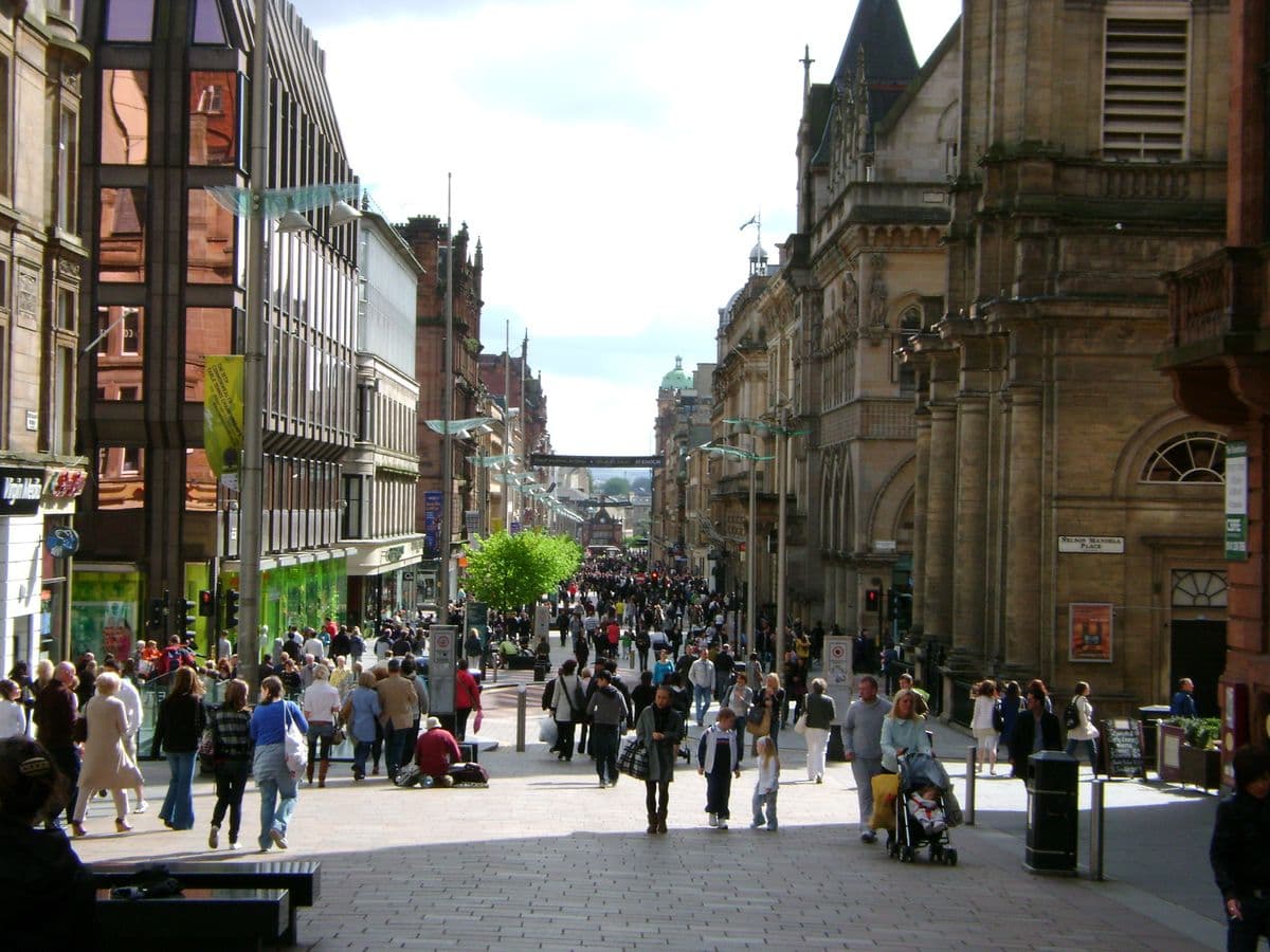 Pedestrian streets and restaurant terraces surrounded by neoclassical architecture in the Merchant City neighborhood, Glasgow.