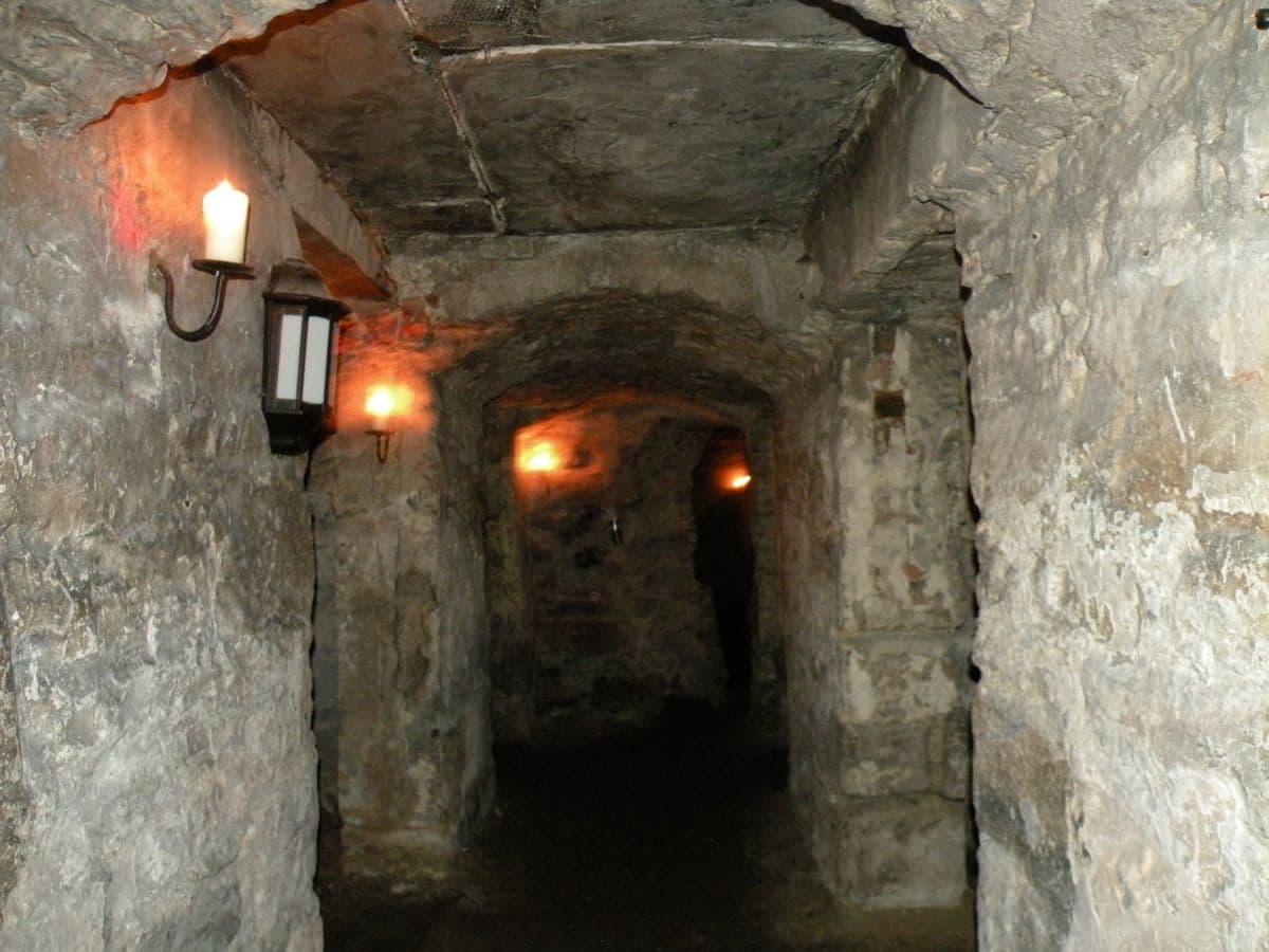 The dark and narrow medieval stone alleys preserved underground at The Real Mary King's Close, Edinburgh.