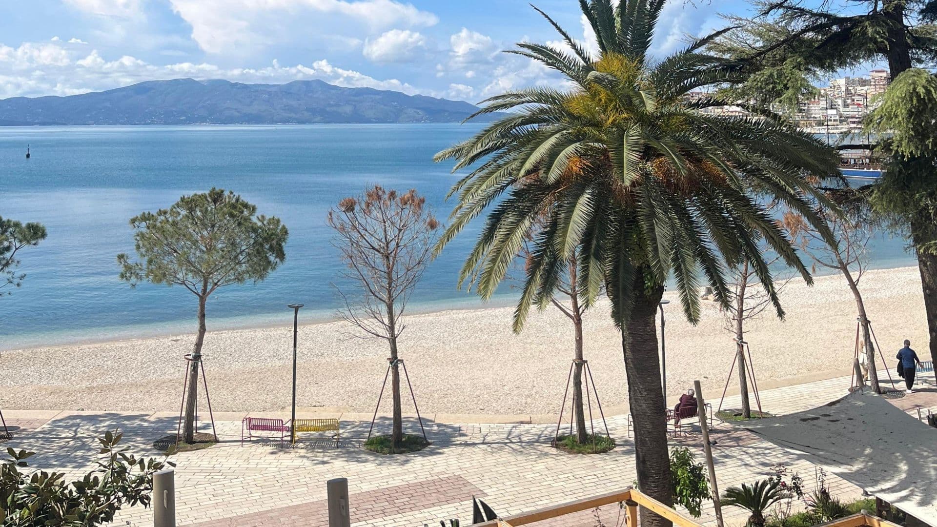 View of the coast from central Sarandë, Albania. Several islands can be seen on the horizon, some belonging to Greece.