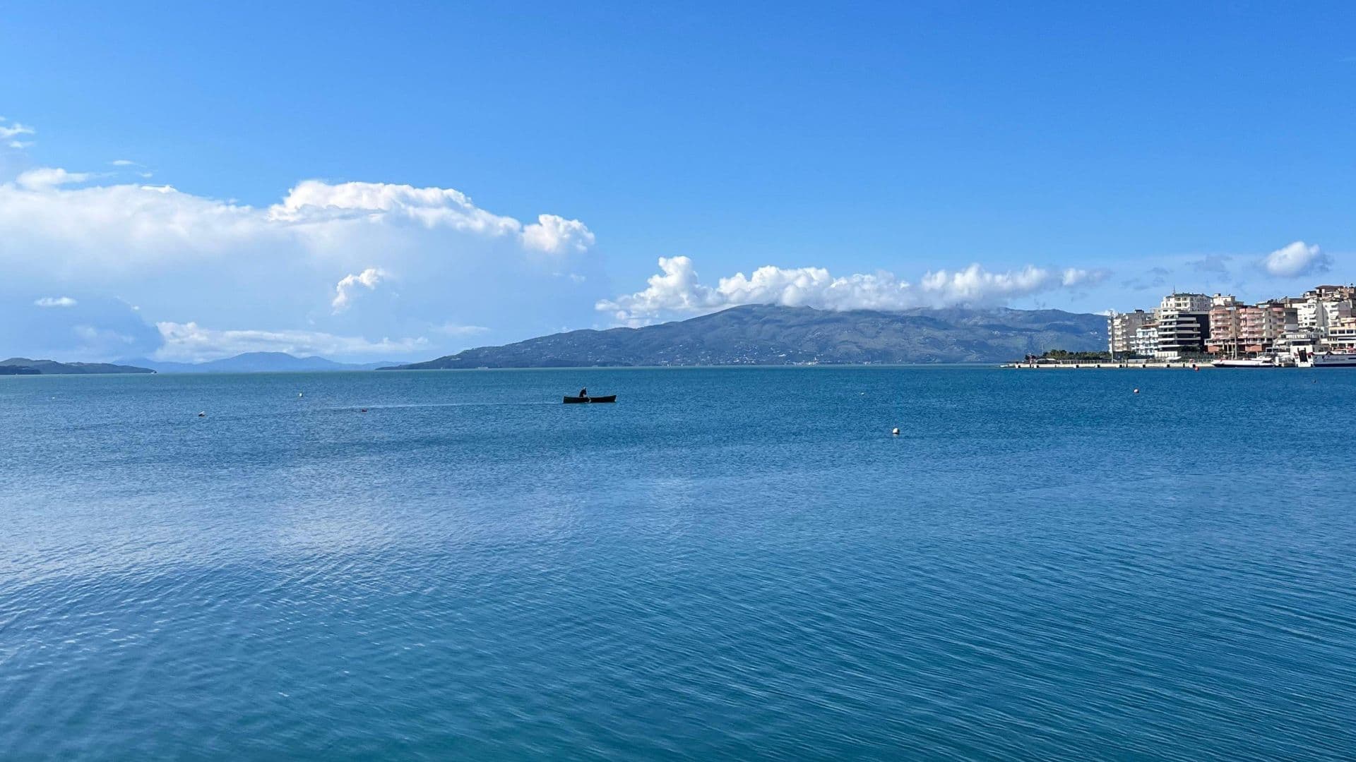 Coast of Sarandë in southern Albania, with crystal-clear waters and Mediterranean landscapes.