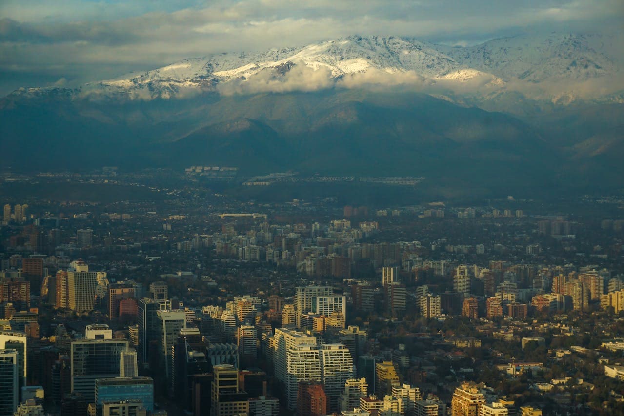 Urban view of Santiago, Chile with the Andes mountain range in the background.