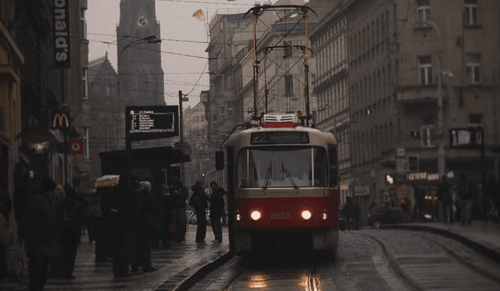 The classic red Prague tram traveling through the city.