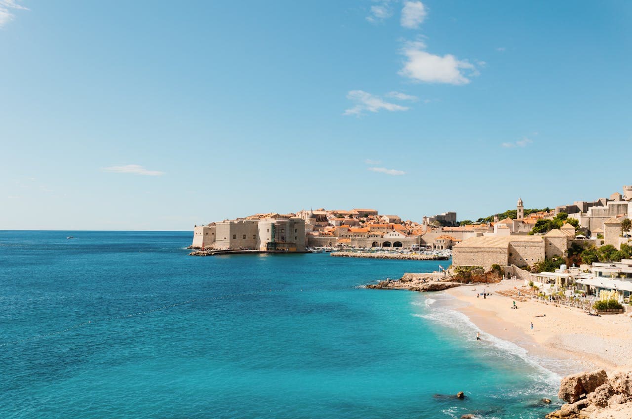 Banje Beach: the balcony over the Adriatic. It is Dubrovnik’s most iconic beach, where you can swim in crystal-clear waters with the old city walls as a backdrop.