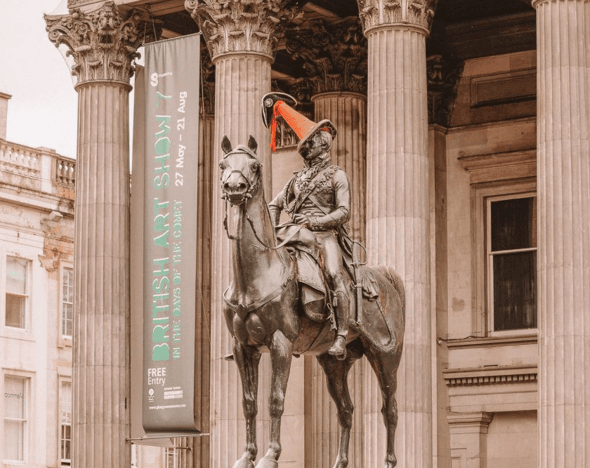 Detail of the Duke of Wellington statue with the iconic orange and white traffic cone on his head.