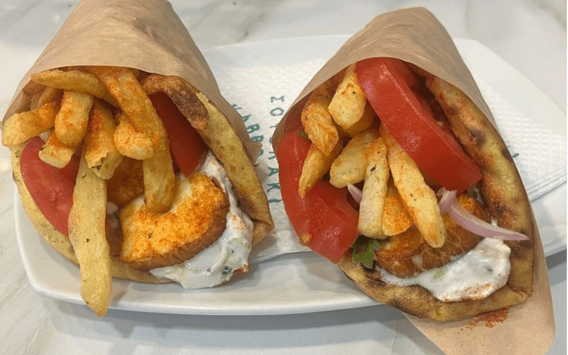 Greek pita gyros with tzatziki sauce. Our favorite Greek food.