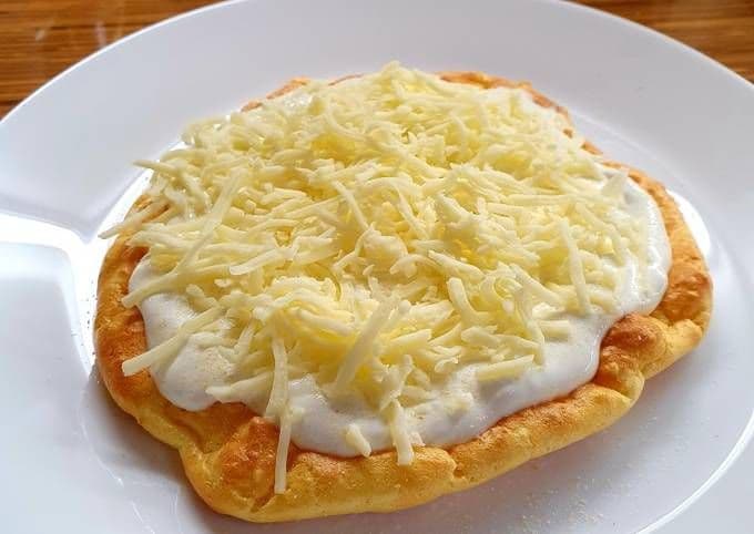 Lángos. The most popular street snack in Hungary, often called the 'Hungarian pizza'.