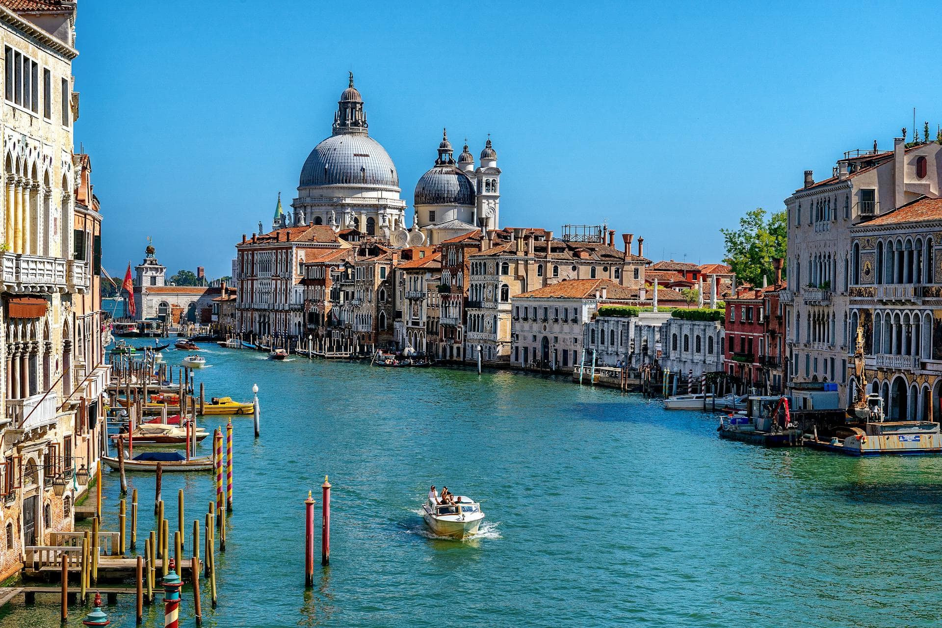 Stunning daytime view of the Grand Canal in Venice, with gondolas and historic architecture.