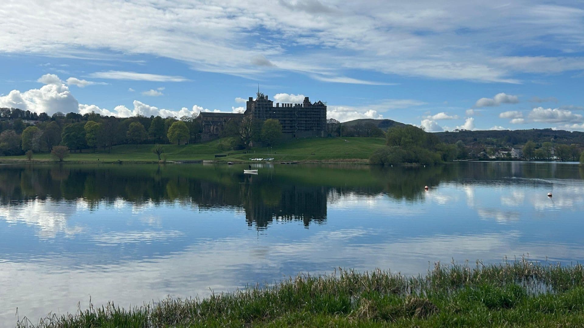 The imposing Linlithgow Palace reflected on the loch. Walking along the circular trail around the lake is a beautiful, flat 45-minute walk.