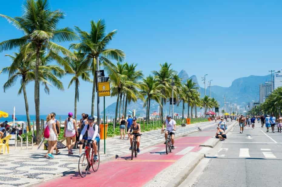 Bike path in Ipanema with a view of the ocean and the Dois Irmãos mountain, Rio de Janeiro, Brazil.