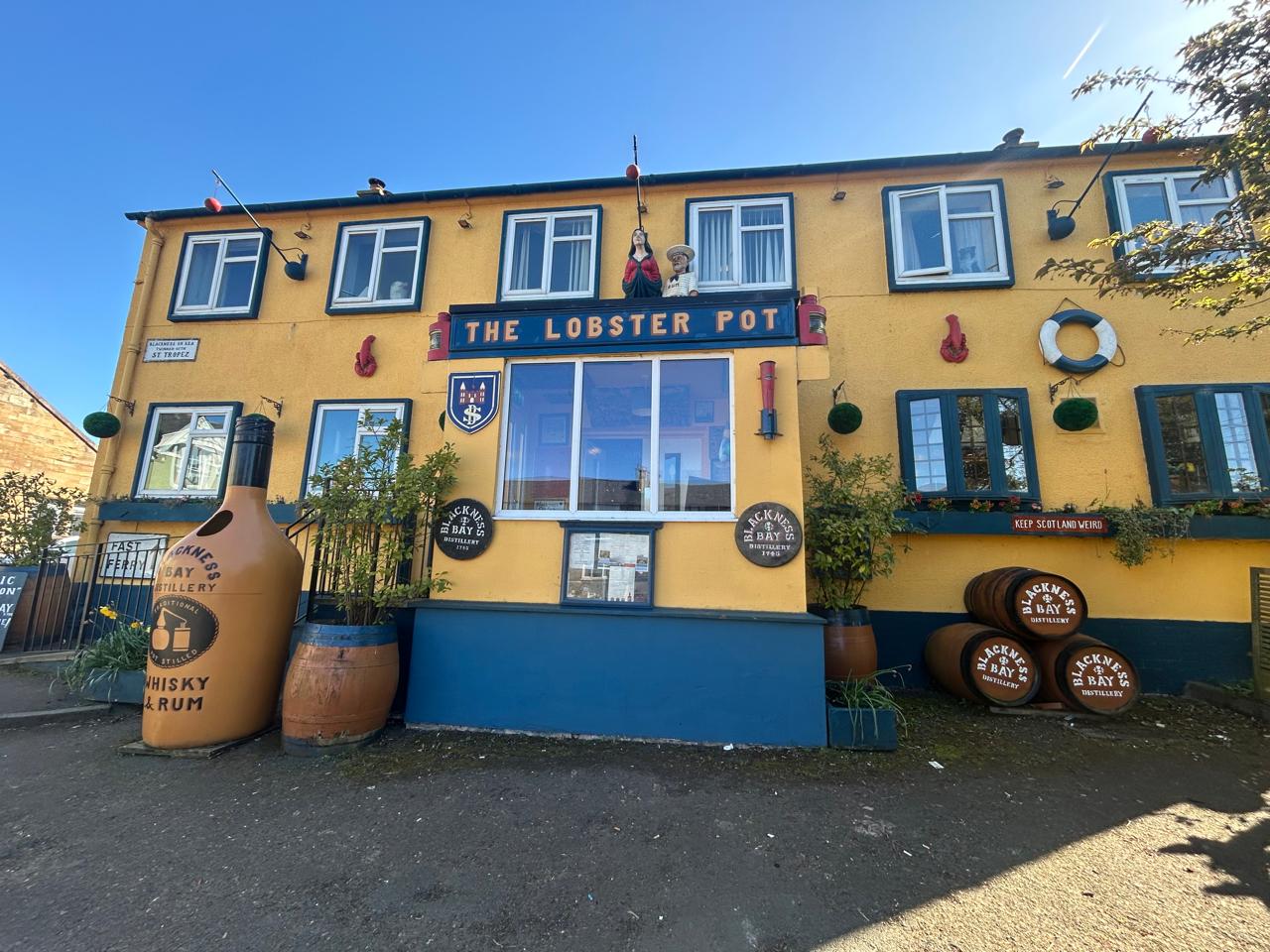 The facade of The Lobster Pot, an old maritime pub whose building retains the charm of old-fashioned harbor taverns and is the meeting point for the nearly 100 residents living in the village.
