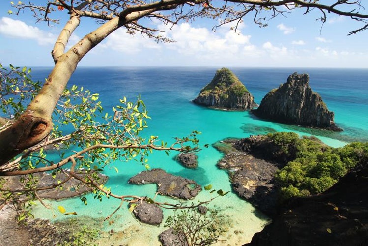 Fernando de Noronha is Brazil's most exclusive and protected ecological sanctuary, a volcanic archipelago of 21 islands located in the Atlantic Ocean, around 360 kilometers off the coast of Natal.