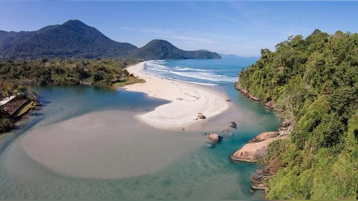 The mouth of the Itamambuca river meeting the ocean in Ubatuba, Brazil.