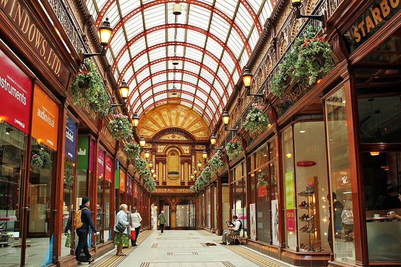 Interior of Grainger Market, bustling with life, food stalls, and Victorian ironwork architecture. Newcastle, England.