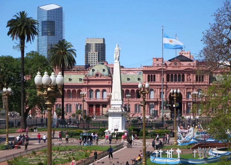 The May Pyramid with Casa Rosada in the background at Plaza de Mayo, Buenos Aires.