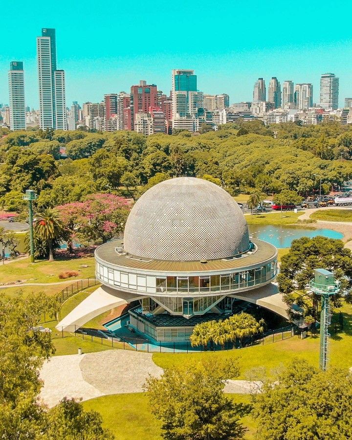 Exterior view of the Galileo Galilei Planetarium surrounded by green parks in Palermo Woods, Buenos Aires.