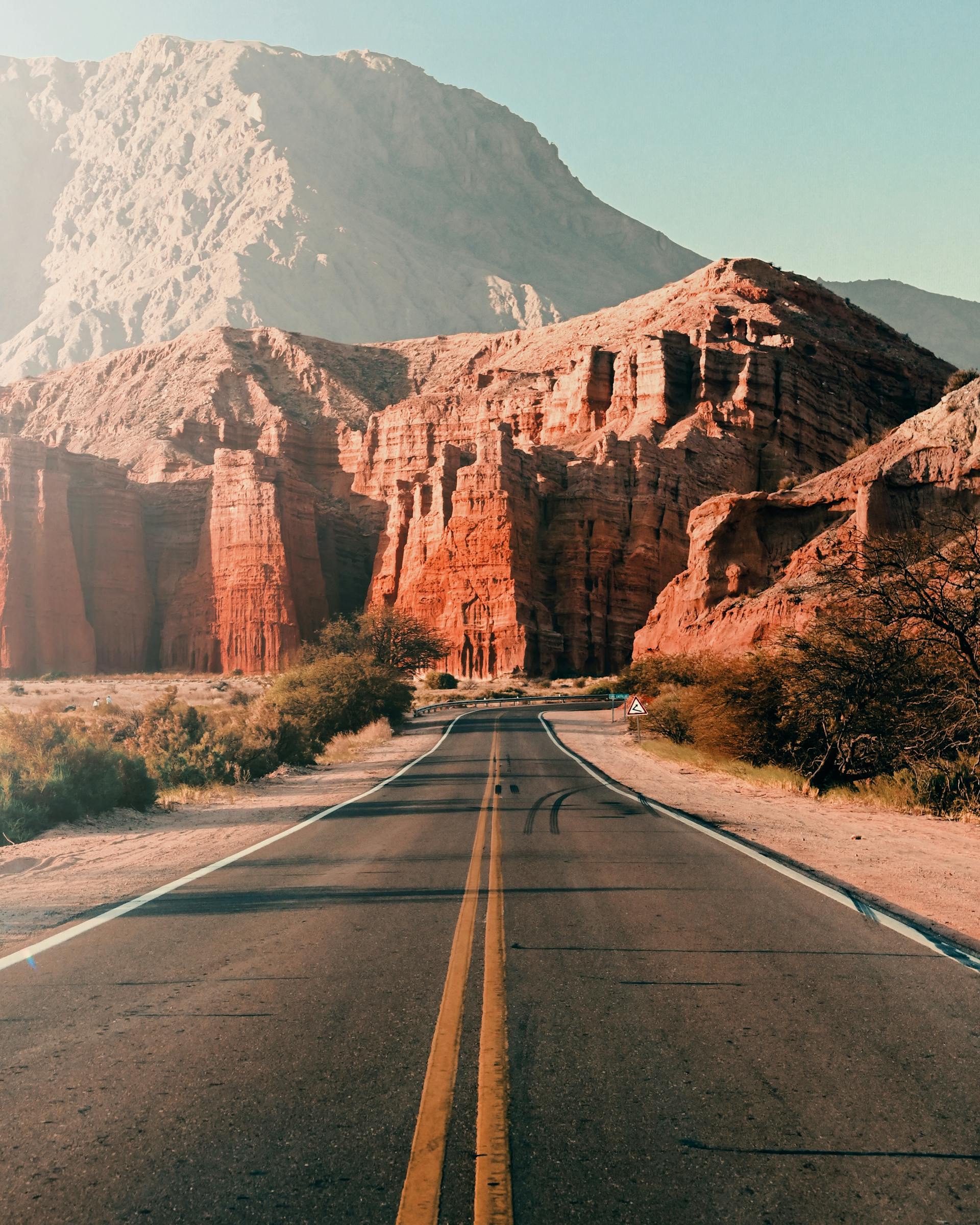 Scenic landscape of Northern Route 40 crossing the Calchaquí Valleys in Salta, with colorful mountains and winding roads.
