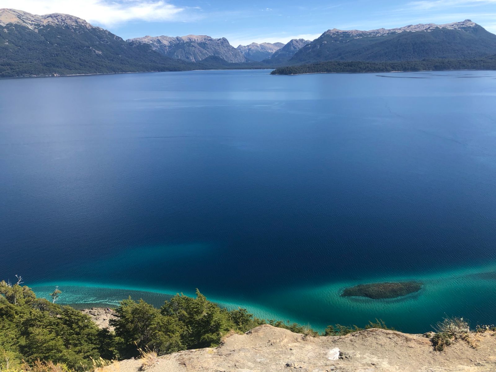 The other side of the viewpoint: while everyone looks towards the port bays, turning around rewards you with this brutal perspective of the vast Nahuel Huapi and its bright turquoise shores.