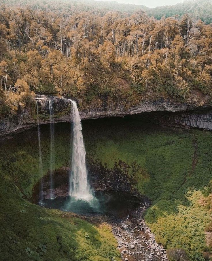 Powerful water drop of the Santa Ana Waterfall framed by a massive volcanic rock cave.